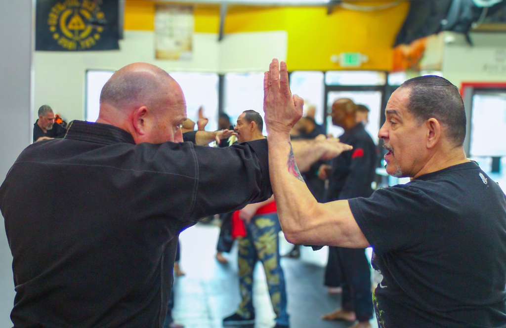 Wing Chun students drilling chain punches and close-range striking combinations